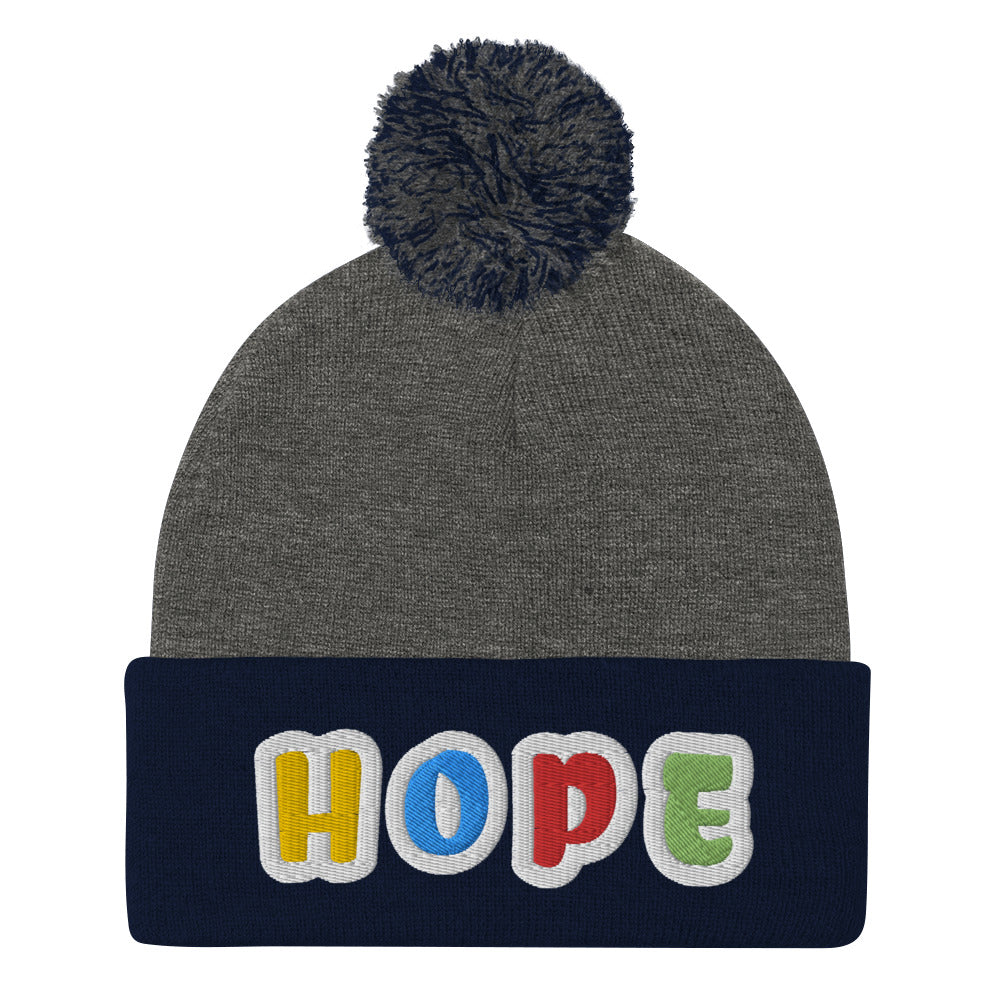 Dauphin_Rose_Couture_pom-pom-knit-cap-dark-heather-grey-navy-front-breast cancer awareness